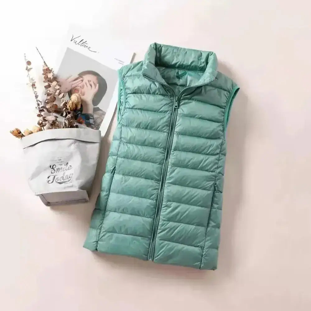 Doudoune sans manche plume gilet matelassé ultra-léger femme teal coupe cintrée col montant et fermeture éclair frontale
